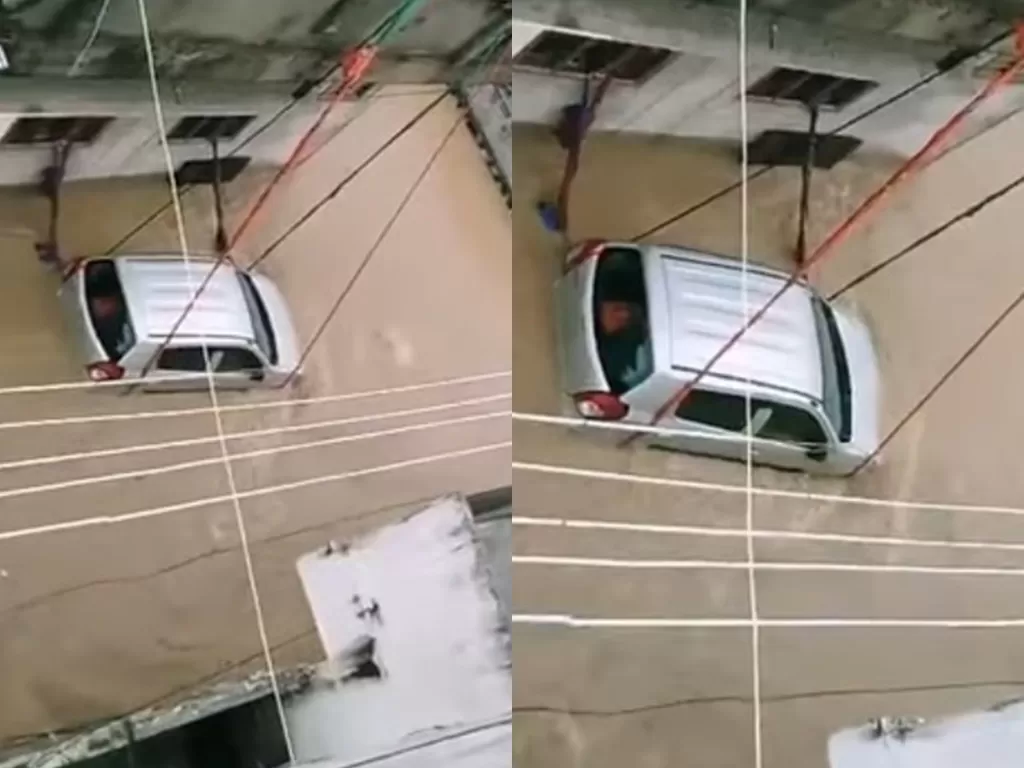 Video mobil diikat dari atas gedung agar tak tersapu banjir. (Photo/YouTube/Telugu Cinema)