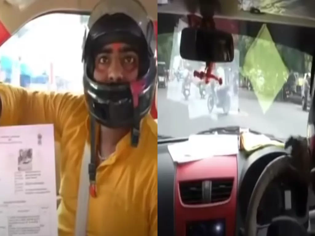 Pria yang ditilang polisi karena tak pakai helm saat menyetir mobil. (Youtube/News24)