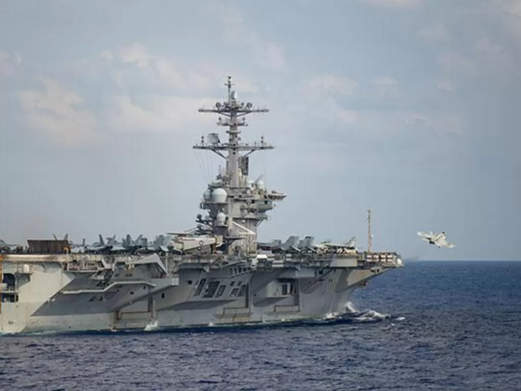  Ilustrasi. Kapal induk Angkatan Laut Amerika Serikat USS Theodore Roosevelt di Laut Filipina, 18 Maret 2020. (photo/Nicholas V. Huynh via REUTERS/ilustrasi)