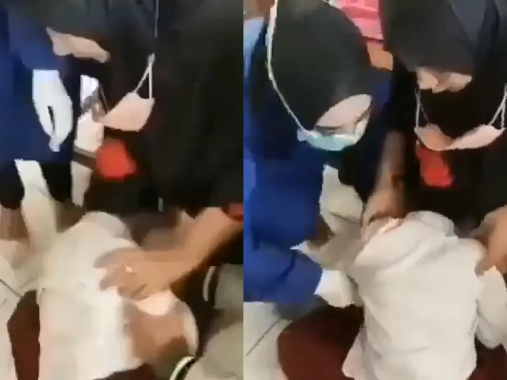 Bocah SD menangis tak karuan saat petugas hendak menyuntikan vaksin ke lengannya (Istimewa)