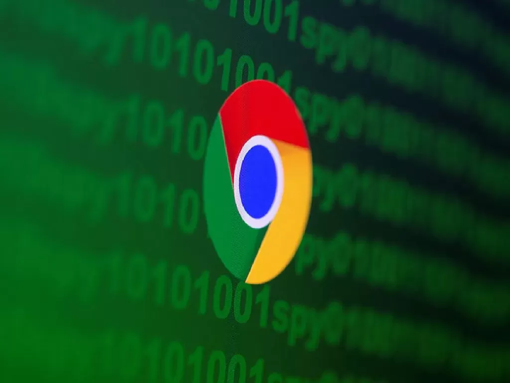 Tampilan logo Google Chrome dengan background kode binary (photo/REUTERS/Dado Ruvic)
