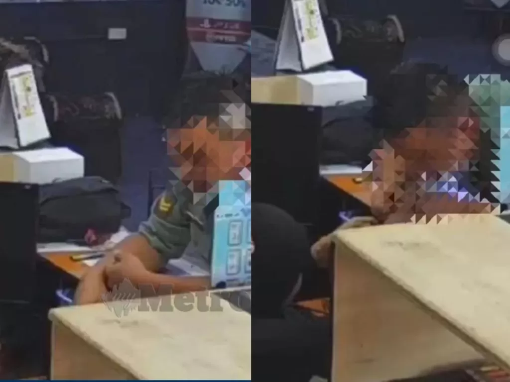 Oknum tentara terekam CCTV menjilati tangan seorang pekerja di toko menjual vape di Ampang, Selangor, Malaysia (Harian Metro)