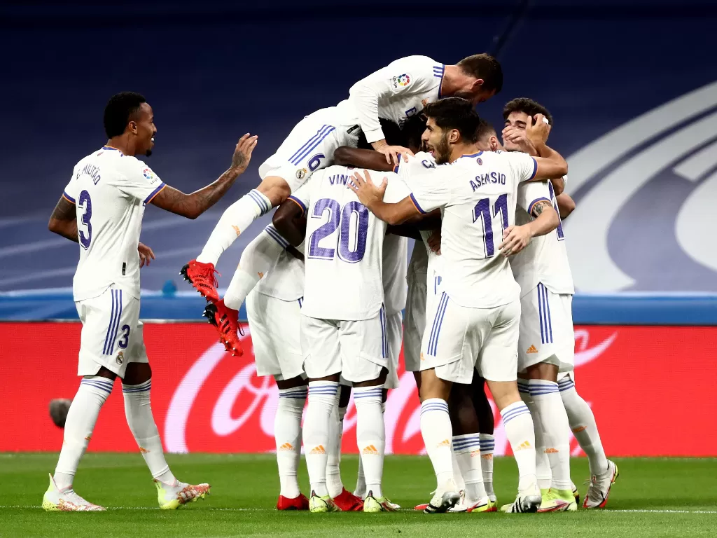 Pemain Real Madrid melakukan selebrasi. (photo/REUTERS/Sergio Perez)