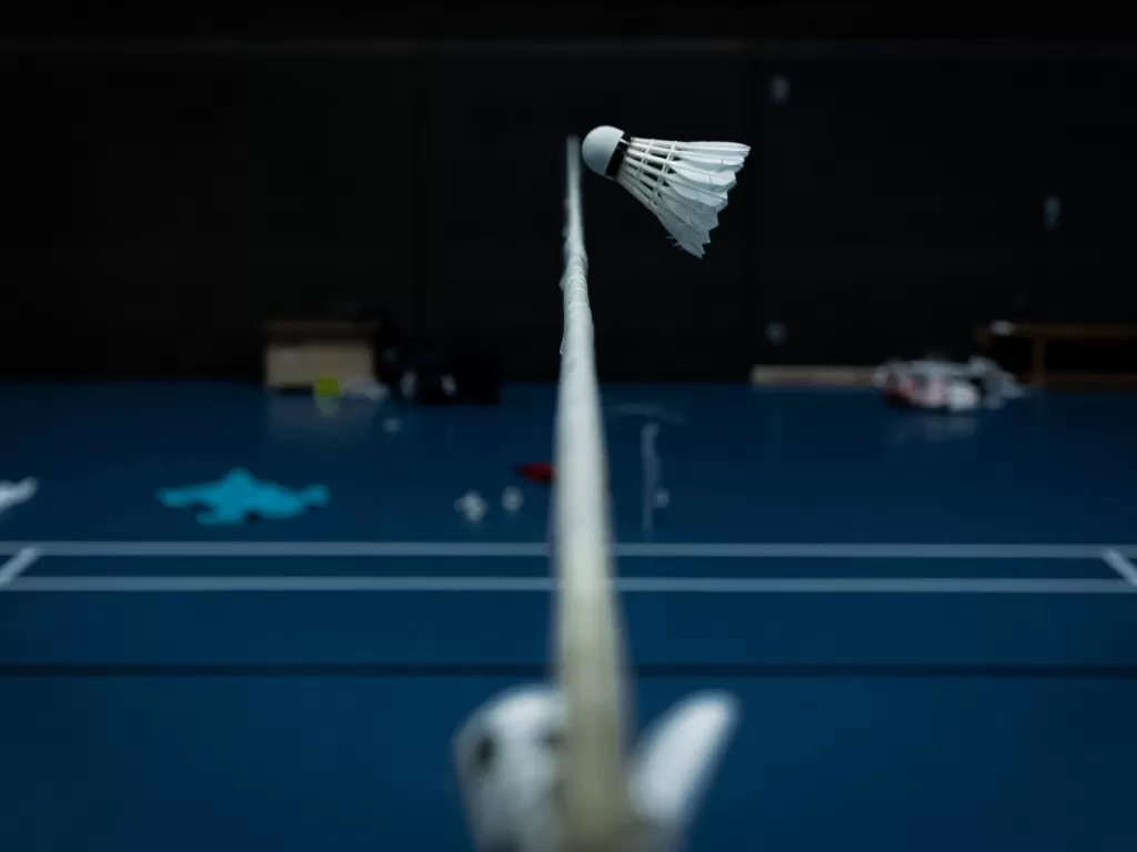 Ilustrasi lapangan badminton. (photo/Unsplash/Stephan Rothe/ilustrasi)