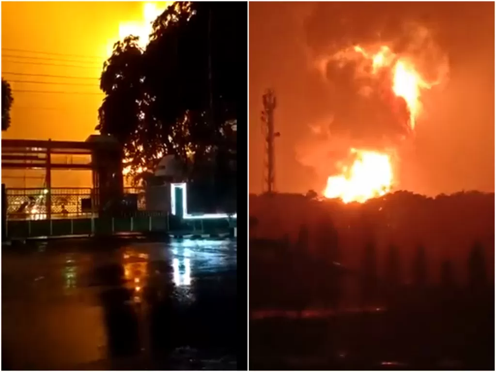  Cuplikan video viral tangki kilang Pertamina Cialacap terbakar, Sabtu (13/11/2021). (photo/Twitter/@marisauhp1)