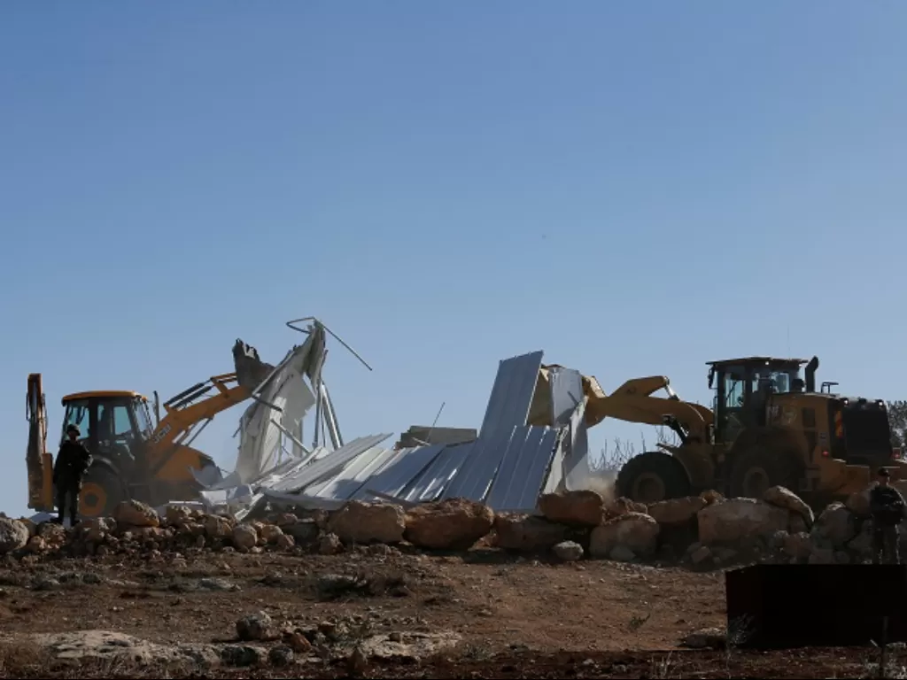 Otoritas Israel bongkar 10 bangunan milik Palestina di Tepi Barat. (REUTERS/Mussa Qawasma)