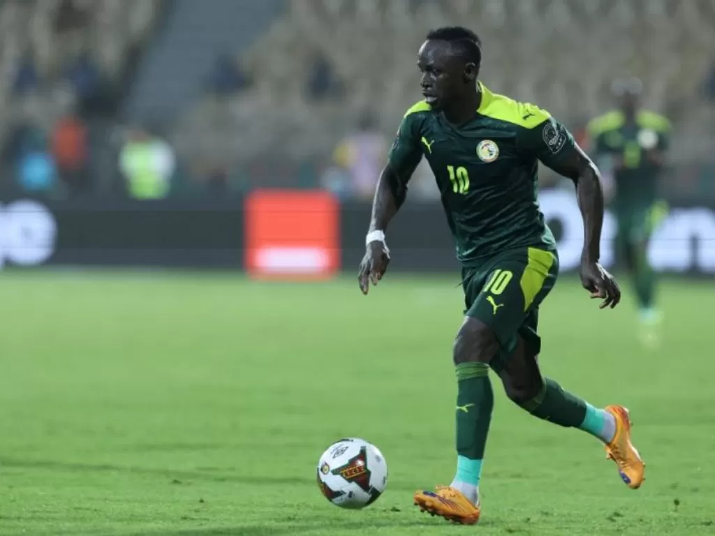 Striker Senegal Sadio Mane membawa gol dalam pertandingan semifinal Piala Afrika 2021 melawan Burkina Faso di Stade Ahmadou-Ahidjo di Yaounde pada 2 Februari 2022.(AFP/KENZO TRIBOUILLARD)