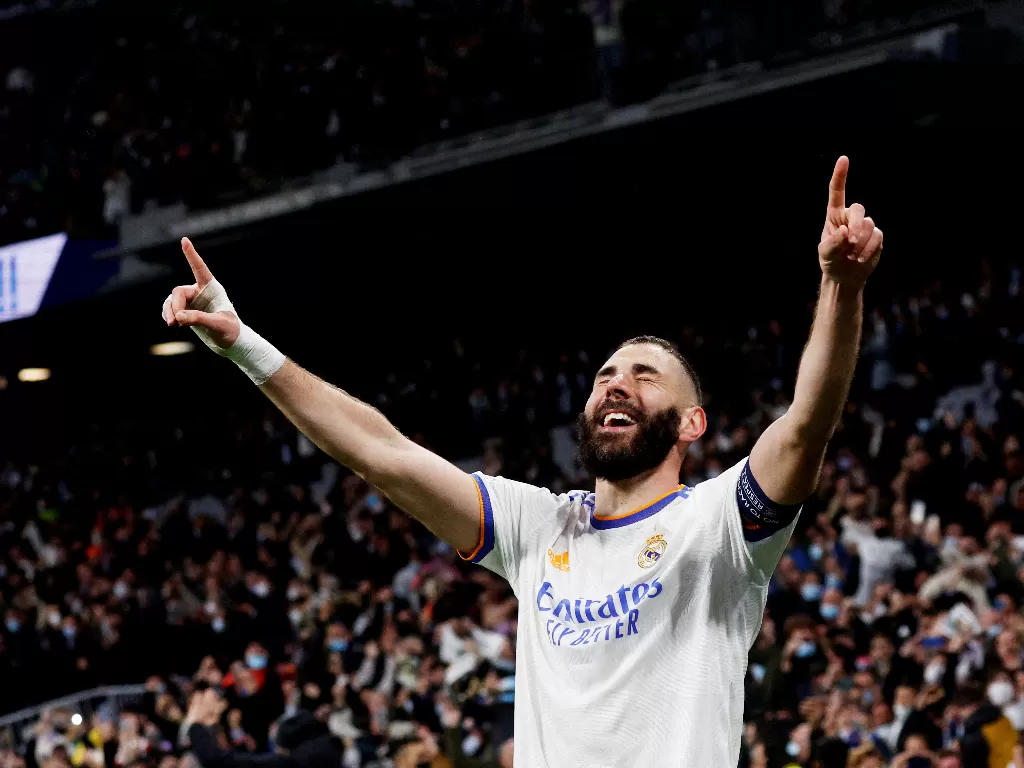Karim Benzema merayakan gol yang dicetak ke gawang PSG. (REUTERS/Susana Vera)