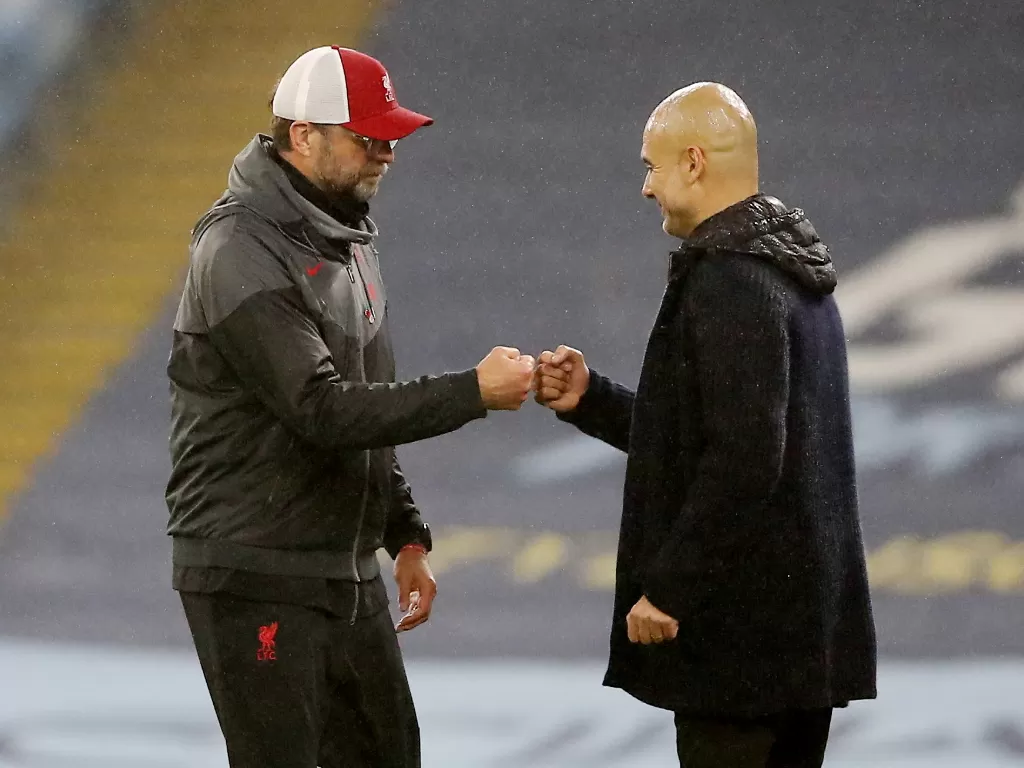 Jurgen Klopp dan Pep Guardiola, pelatih Liverpool dan pelatih Manchester City. (REUTERS/Martin Rickett)