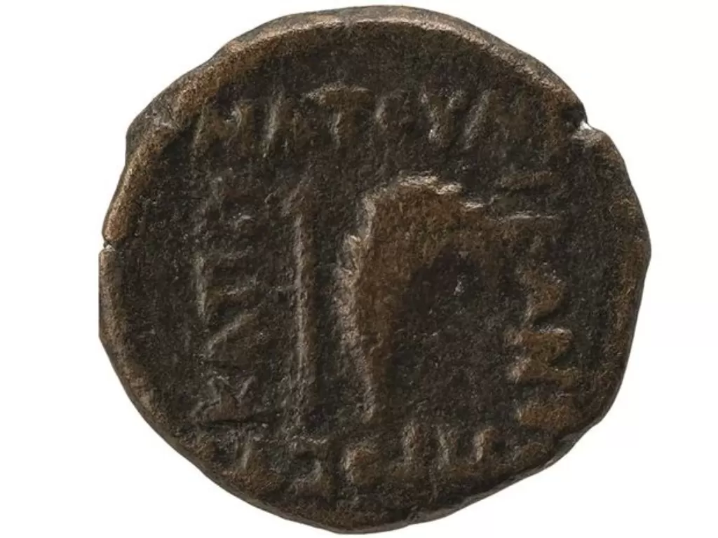Koin yang menampilkan kota kuno. (IFLScience)