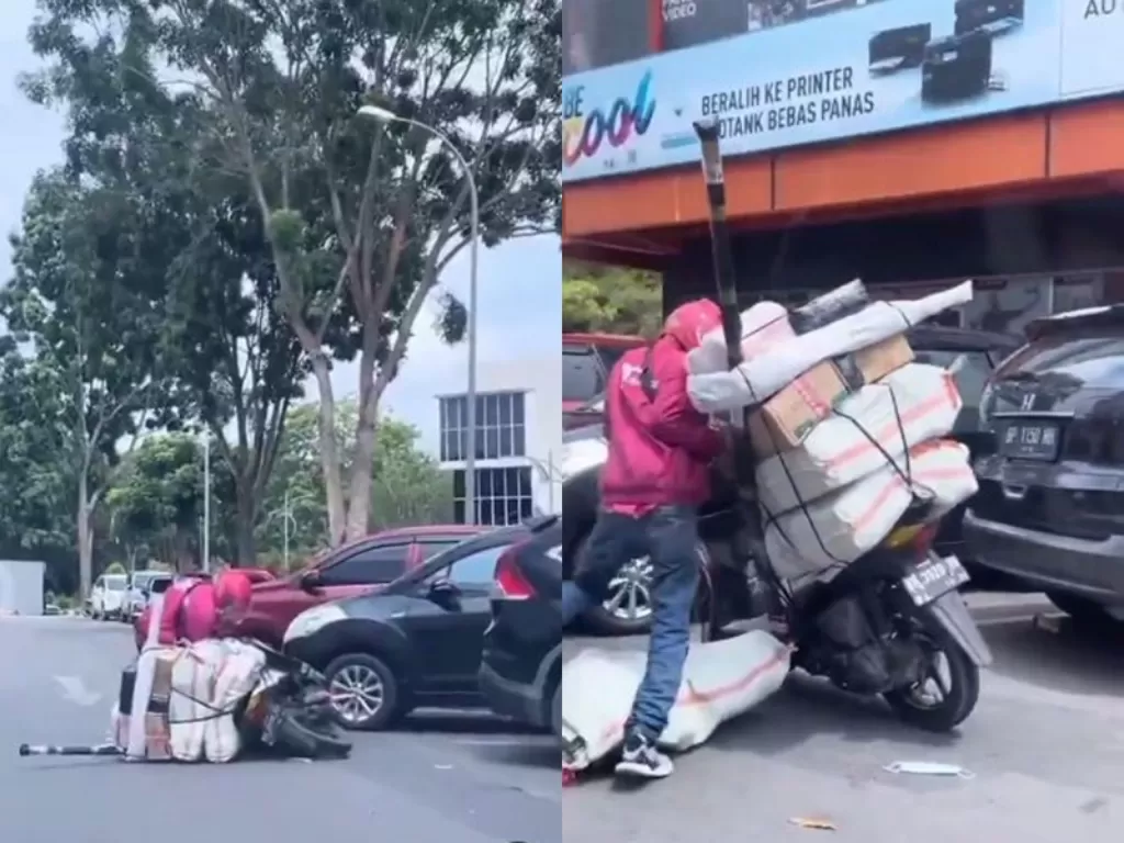 Driver ojol yang terjatuh di tengah jalan karena keberatan membawa paket. (Instagram/@dramaojol.id)