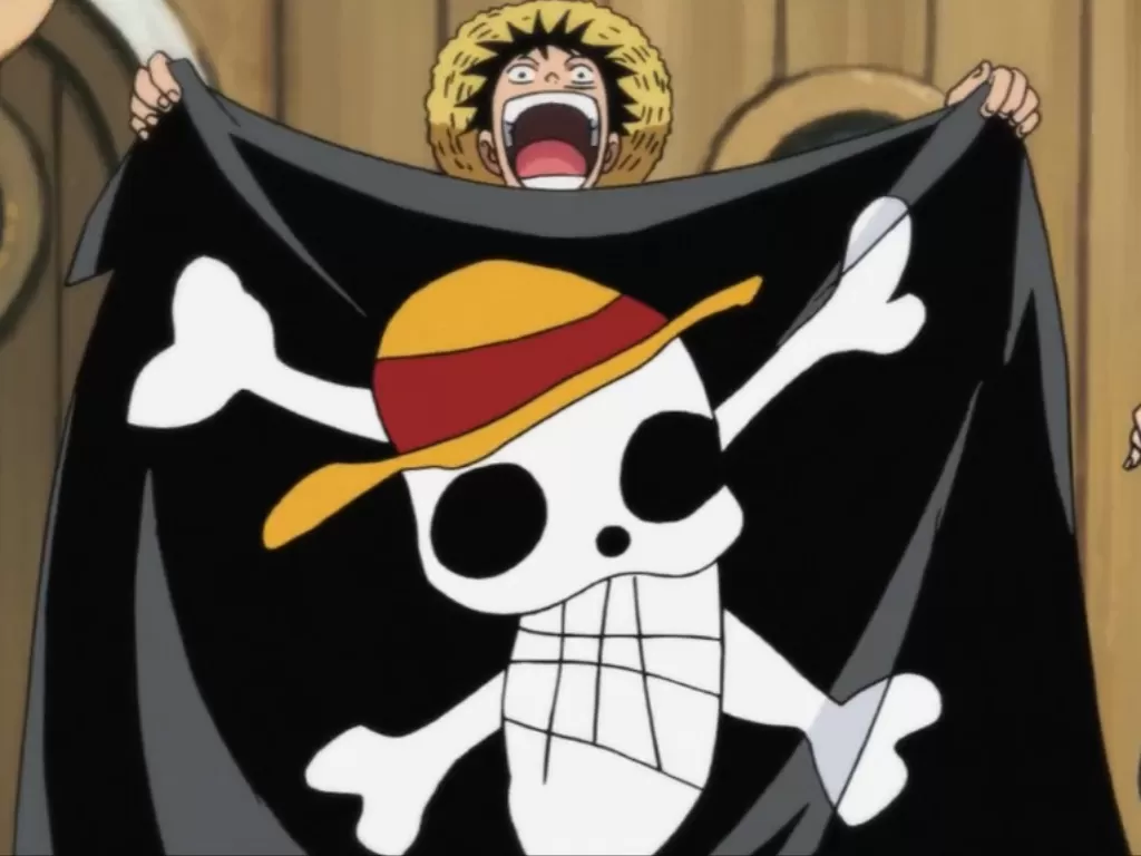 Mugiwara No Luffy mengibarkan bendera Topi Jerami. (one piece wiki fandom)