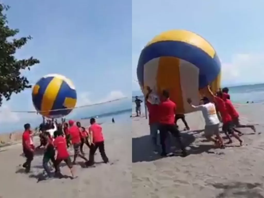 Sekelompok pria memainkan voli pantai dengan bola yang super besar. (Instagram/@andreli_48)