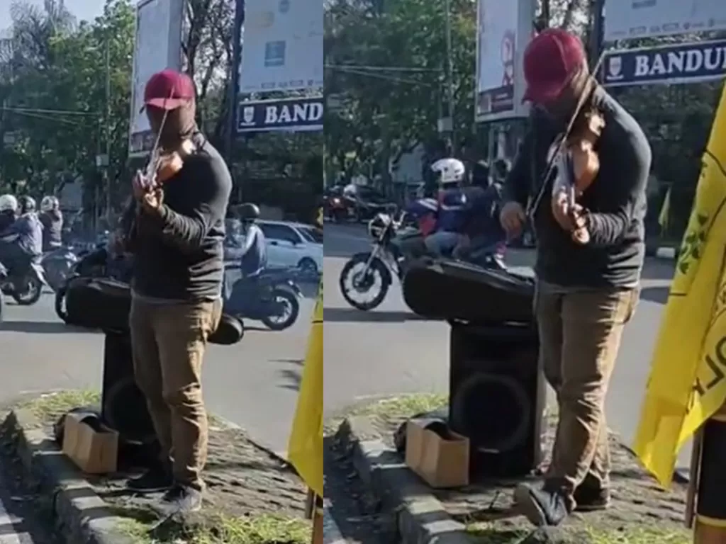 Musisi jalanan memainkan biola di Bandung (TikTok/kochan.03)