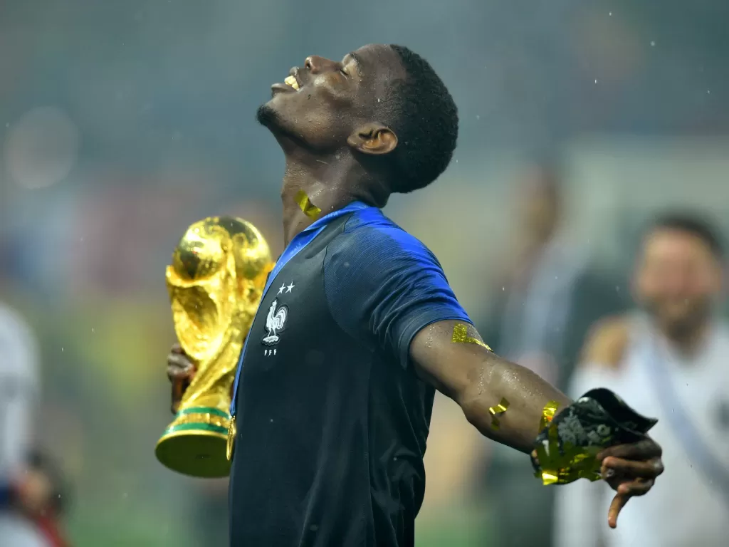 Paul Pogba rayakan kemenangan Prancis di Piala Dunia 2018. (REUTERS/Dylan Martinez)