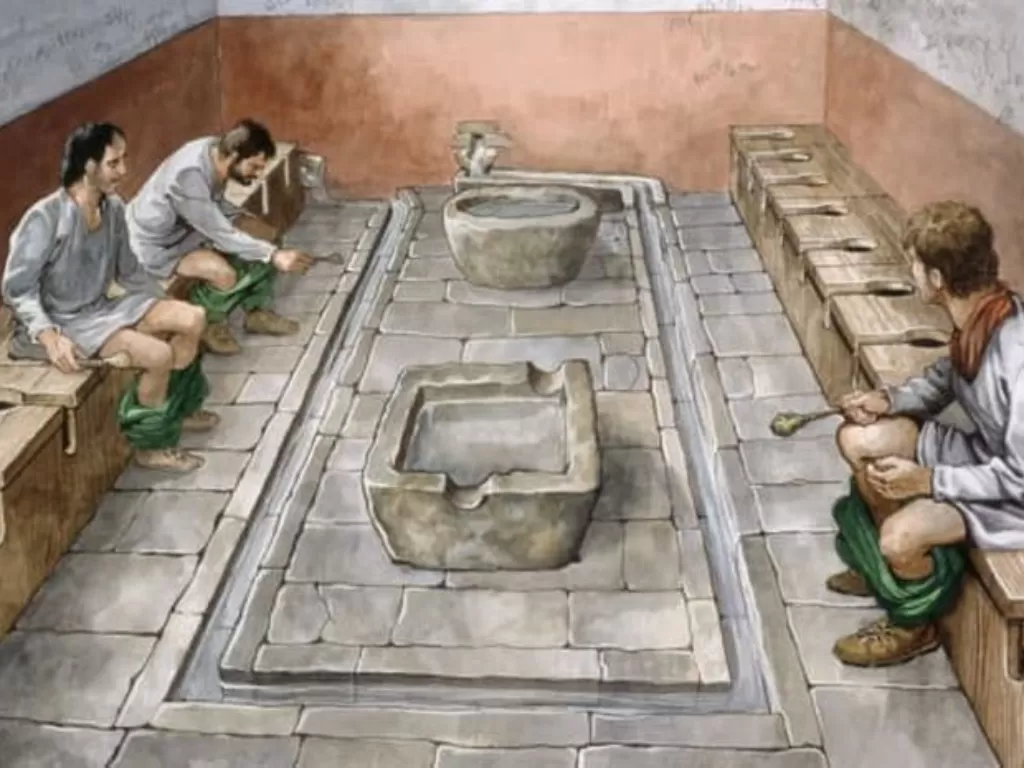 Ilustrasi toilet umum di zaman Romawi (Wikimedia Commons)