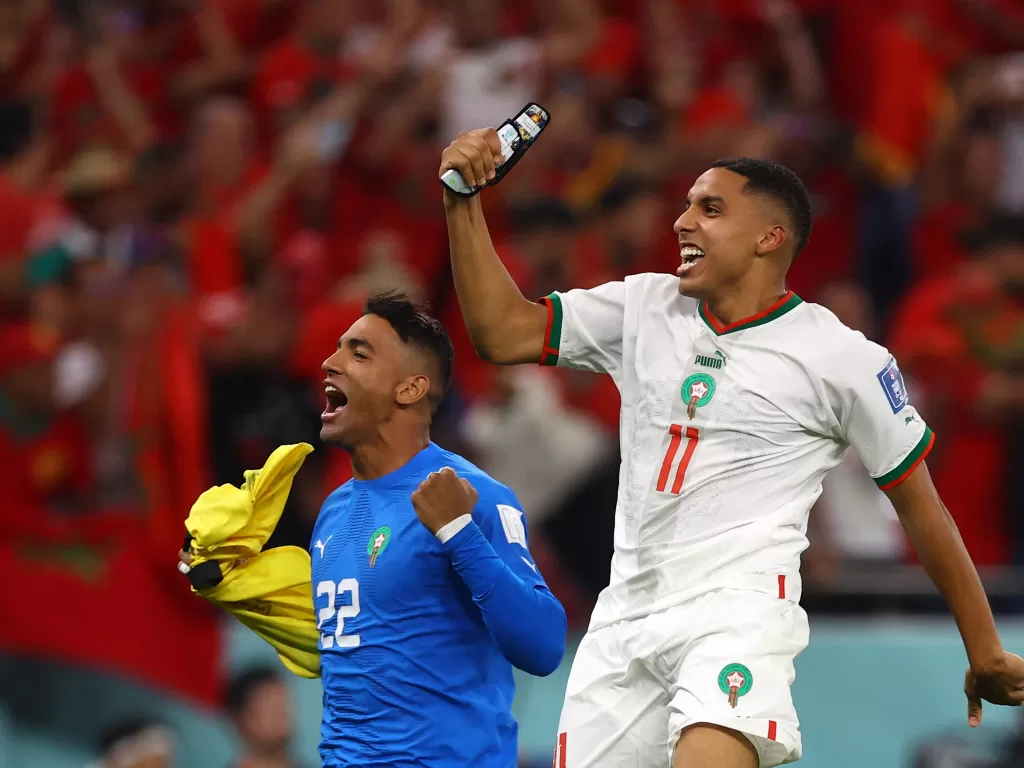 Maroko merayakan kemenangannya saat melawan Kanada. (REUTERS/Lee Smith)