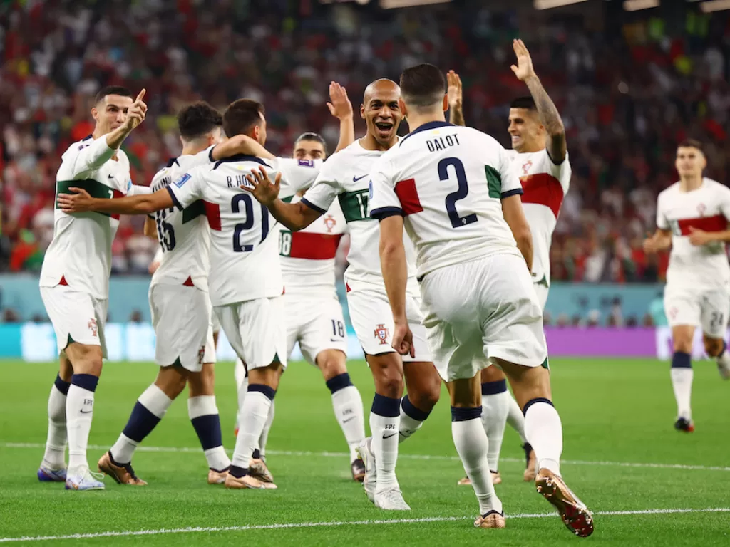 Pemain Timnas Portugal melakukan selebrasi (REUTERS/Kai Pfaffenbach)
