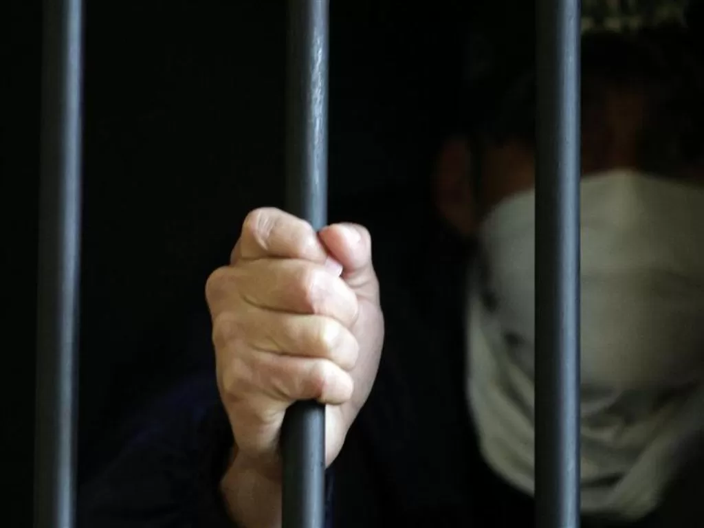 Ilustrasi seseorang yang sedang berada di penjara. (REUTERS/Jorge Adorno)