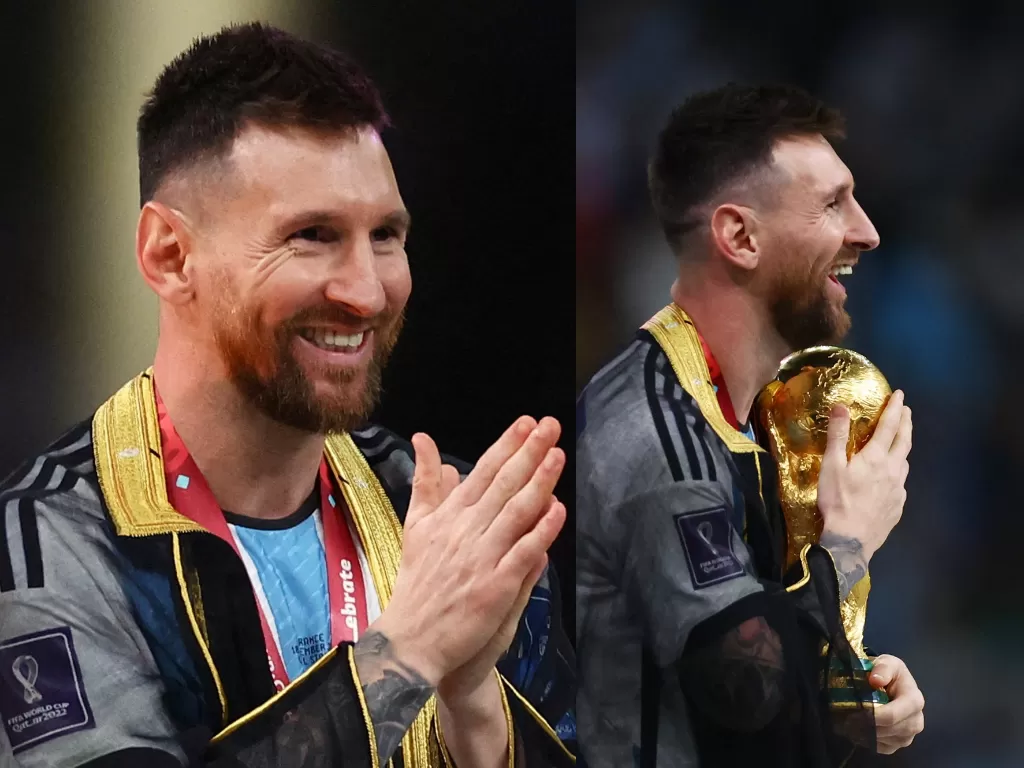 Lionel Messi pakai jubah hitam dalam perayaan Argentina juara Piala Dunia 2022. (REUTERS/Kai Pfaffenbach)