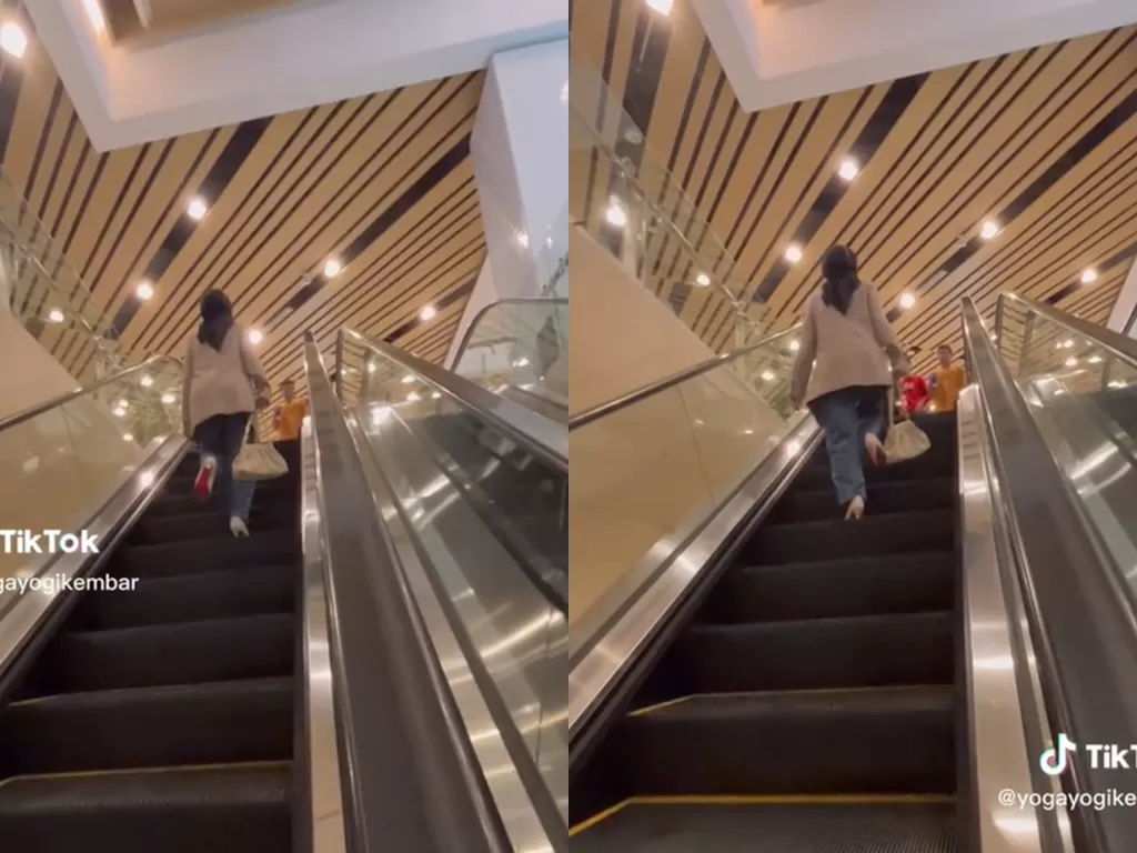 Wanita cantik salah naik eskalator. (TikTok/@yogayogikembar)