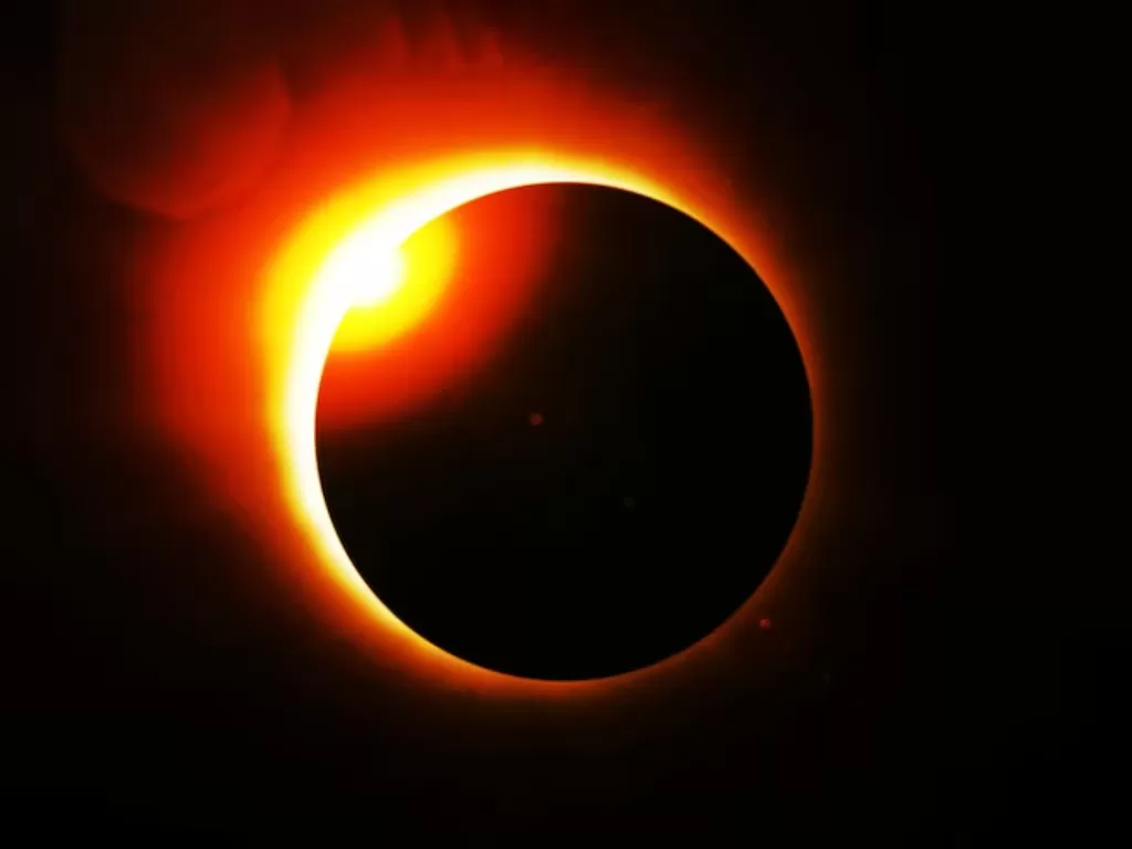 Ilustrasi gerhana matahari hibrid. (Freepik/archangel808892)