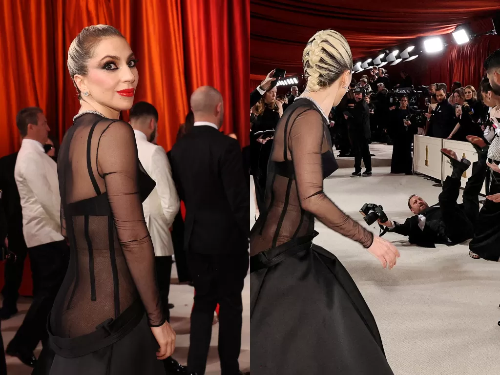 Momen Lady Gaga berlari ke arah belakang membantu fotografer yang jatuh di red carpet Oscar, Minggu (12/3/2023) (REUTERS/Mario Anzuoni)