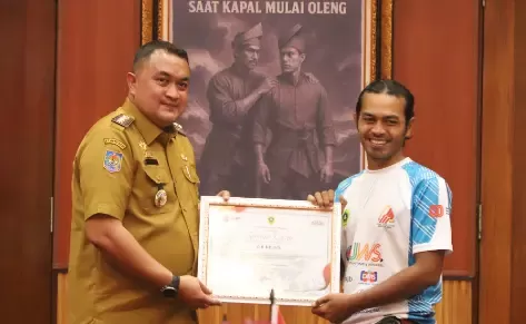 Bupati Bogor Apresiasi FPTI Kibarkan Bendera Merah Putih Terbesar di Tebing Lidah Jegger, Catat Rekor MURI