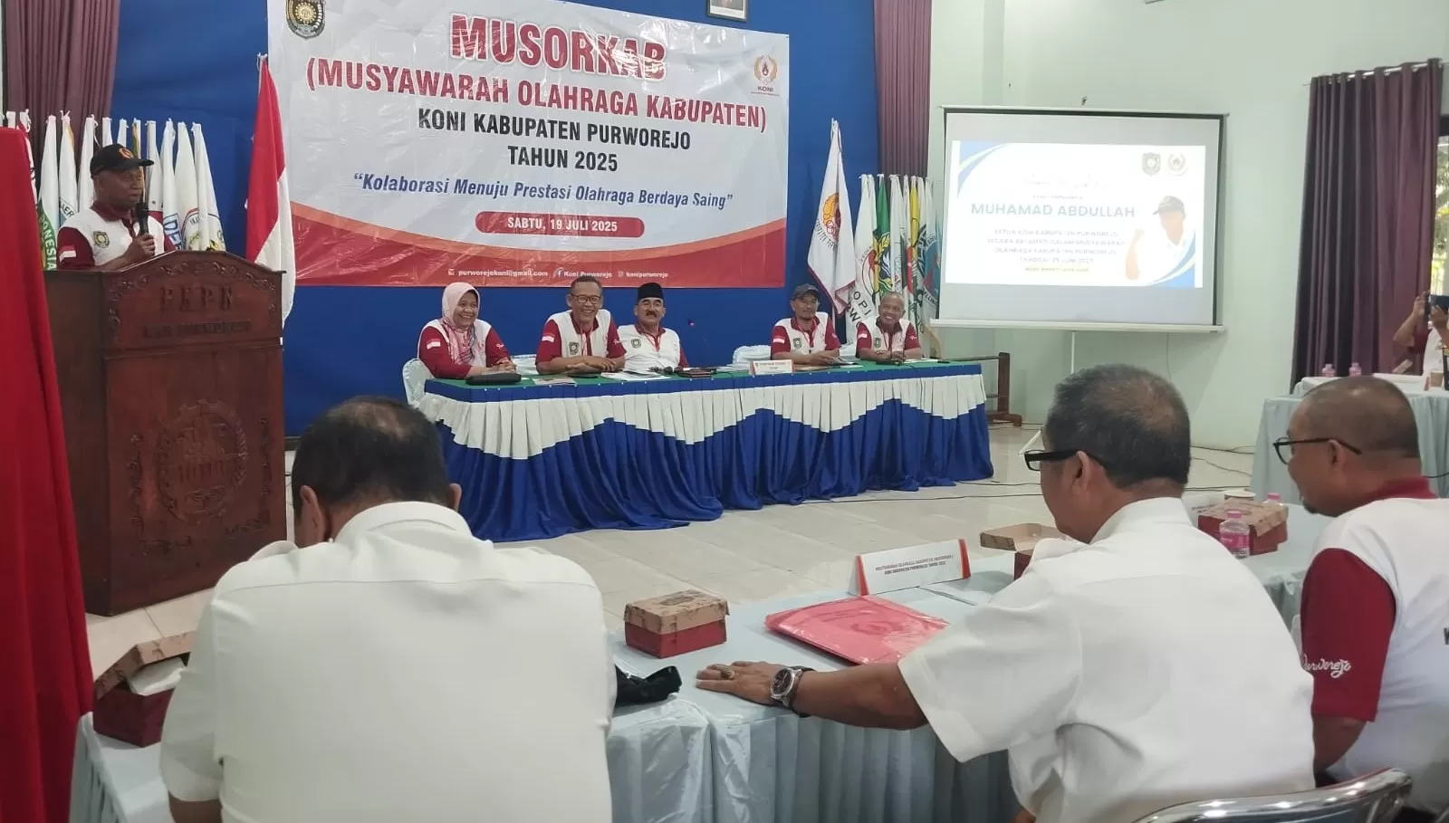 Sambutan perdana Ketua KONI Kabupaten Purworejo 2025- 2029 M Abdullah dalam Musorkab KONI Purworejo di Gedung KPPRI Purworejo.  (Hendri Utomo)