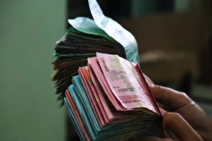 THR untuk driver ojol Gojek dan Grab dan pernyataan Menaker (Foto: GENMUSLIM.id/dok: Unsplash.com/Mufid Majnun)