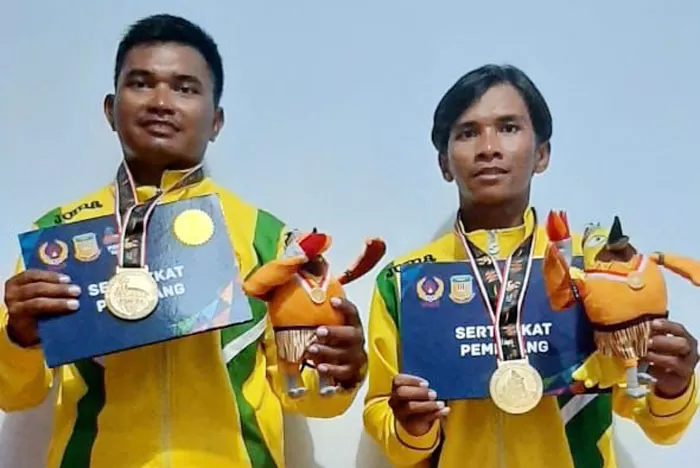 PAHLAWAN OLAHRAGA: Riski dan Nugie adalah pasangan putra yang turut menyumbangkan medali emas untuk kontingen Kaltim di PON XX Papua.
