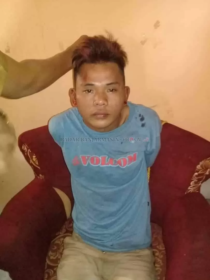 DIAMANKAN: Pelaku pencuri motor yang diamankan warga di Desa Raden Kecamatan Kurau.