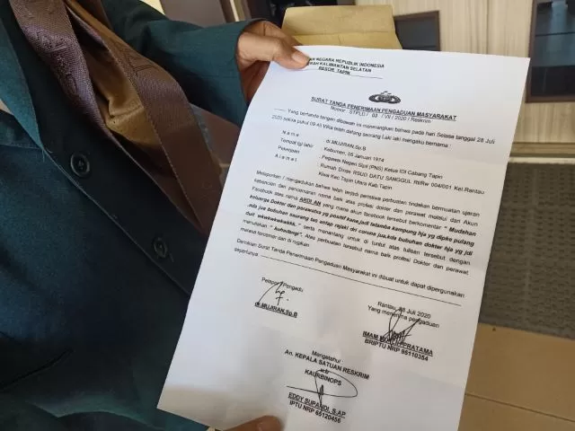 KEBERATAN: Surat pengaduan Ikatan Dokter Indonesia (IDI) dan Persatuan Perawat Nasional Indonesia (PPNI) Tapin ke polisi. | Foto: Rasidi Fadli/Radar Banjarmasin