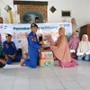 Satpolairud Polresta Sidoarjo Kawal Penyaluran Bansos BMH kepada Da’i dan Guru Ngaji di Desa Pucukan