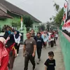 Gerak Jalan Sehat Semarak HUT Ke-81 RI di Teras, Babinsa Bersama Aparat Pastikan Kegiatan Aman dan Lancar