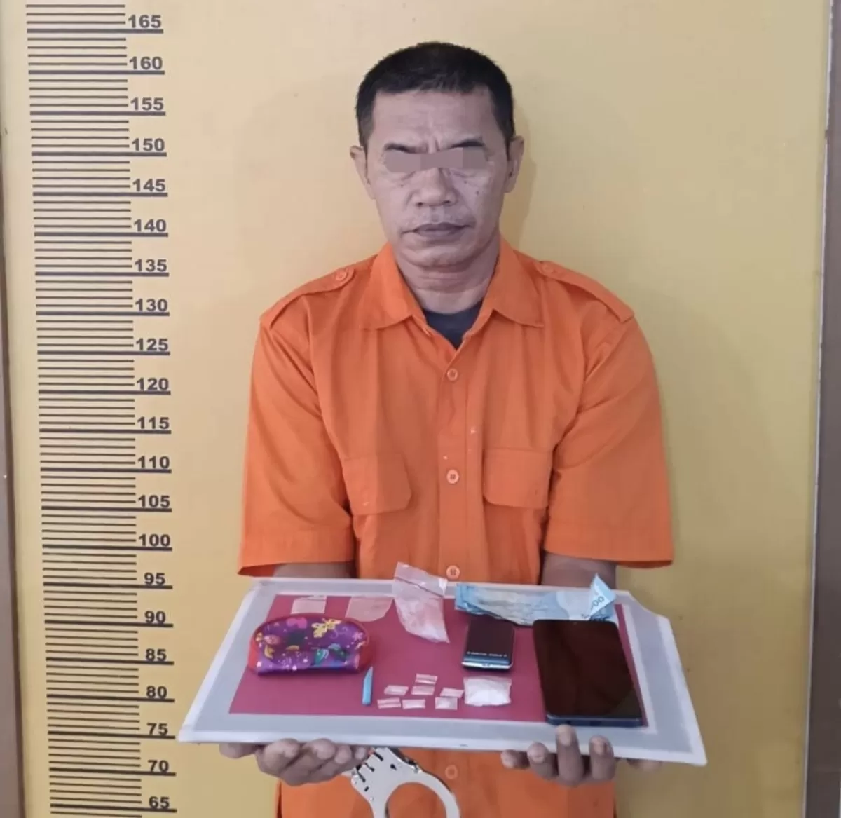Tersangka Rudi