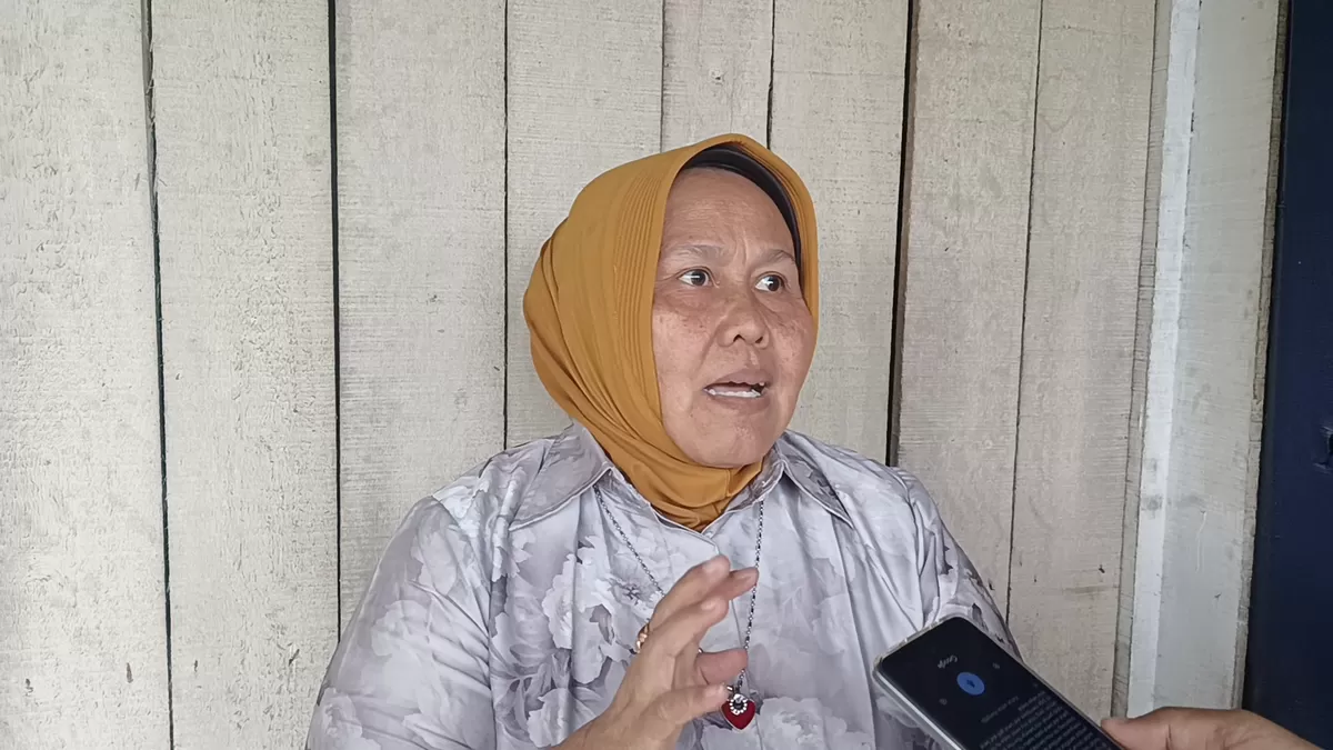 Hj Yuliati Barus.