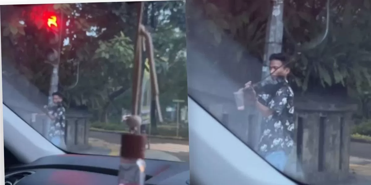 Aksi pengamen biola Menteng, Mas Is, bikin pengendara terpukau hingga enggan jalan saat lampu hijau.   (Threads.com/@hellomichhh)