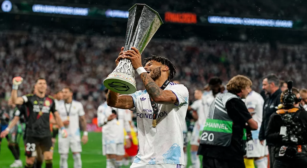 Tyrone Mings dan Aston Villa datang ke Asia dalam tur pra musim, sebagai juara UEFA Eropa League (UEL). Sebagai pribadi ia merasa ia harus bekerja lebih keras lagi karena ia kerap diingatkan oleh pelatih kepala/manajer, Unai Emery. (Instagram Tyrone Mings/Chat GPT)