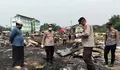 ​Polsek Kampar Kiri Salurkan Bansos dan Bersihkan Puing Kebakaran Ponpes Syekh Burhanuddin