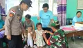 Wujud Sinergitas, Babinsa dan Babinkantibmas Desa Moronge Kompak Pantau Kegiatan Posyandu