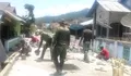 Babinsa Koramil 04/Rainis bersama warga gotong royong pembuatan jalan desa