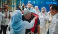 Disambut Ulos di Kualanamu, Bupati Anton Bawa Misi Kolaborasi dan Program Terbaik Untuk Rokan Hulu