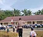 Hadir Sebagai Pembina Upacara Bendera, Bhabinkamtibmas Polsek Hampar Sampaikan Pesan Kamtibmas