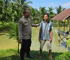 Dukung Ketahanan Pangan, Bhabinkamtibmas Rumbai Bukit Cek Kolam Patin Warga Binaan
