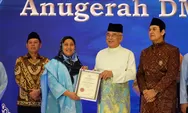 Endang Syah Afandin Terima Anugerah Tun Fatimah pada Konvensyen Dunia Melayu Dunia Islam