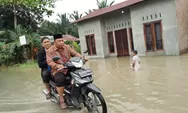 Pastikan Akad Nikah Pengantin, Penghulu di Pantai Cermin Tembus Banjir Serdang Bedagai