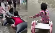 Di Tengah Bencana Banjir, Anak-anak Bekasi Tetap Ceria Main Air Bak Wahana Rekreasi