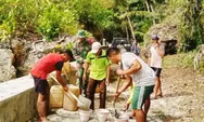 Kemanunggalan TNI-Rakyat di Marampit Timur: Bersihkan dan Perbaiki Jalan Produksi Terdampak Hujan.