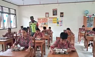 Babinsa Bowombaru Serka Sarlis Pontoh Dampingi Pemberian Makanan Bergizi Gratis di SD Inpres Bowombaru Talaud